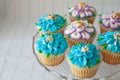 Blue and Purple frosted cupcakes decorated with gold dust