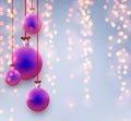 Blue and purple gradient christmas balls hanging on red ribbons with bow Royalty Free Stock Photo