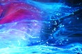 Blue and purple paints and inks swirling together in water background Royalty Free Stock Photo