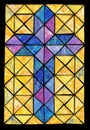 blue, purple, pink stained glass effect cross on yellow and orange textural background