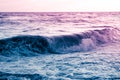 Blue purple rolling wave, a surreal seascape