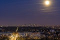 Blue and Purple Sky Over La Defense District at Night With Full Moon