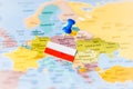 Blue push pin pointing at Poland with Polish flag on a political world map Royalty Free Stock Photo