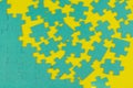 Blue puzzle in disassembled form on a yellow background Royalty Free Stock Photo