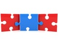A blue puzzle piece as a link between two red puzzle pieces Royalty Free Stock Photo