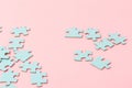 Blue puzzle pieces with empty space for your text and design on pink background Royalty Free Stock Photo