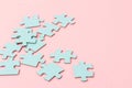 Blue puzzle pieces with empty space for your text and design on pink background Royalty Free Stock Photo