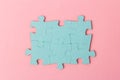 Blue puzzle pieces with empty space for your text and design on pink background Royalty Free Stock Photo