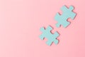 Blue puzzle pieces with empty space for your text and design on pink background Royalty Free Stock Photo