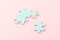 Blue puzzle pieces with empty space for your text and design on pink background Royalty Free Stock Photo