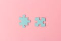 Blue puzzle pieces with empty space for your text and design on pink background Royalty Free Stock Photo