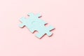 Blue puzzle pieces with empty space for your text and design on pink background Royalty Free Stock Photo