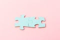 Blue puzzle pieces with empty space for your text and design on pink background Royalty Free Stock Photo