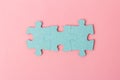 Blue puzzle pieces with empty space for your text and design on pink background Royalty Free Stock Photo