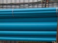 Blue PVC tubes in storage, Plastic tubes