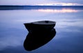 Blue quiet. Boat with reflection.