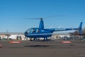 Blue R44 taking off