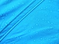 Blue rainproof tent sheet with morning rain drops Royalty Free Stock Photo
