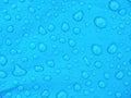 Blue rainproof tent sheet with morning rain drops Royalty Free Stock Photo