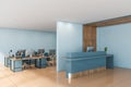 Blue reception desk in open space office Royalty Free Stock Photo