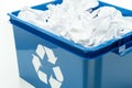 Blue recycling bin box with paper waste Royalty Free Stock Photo