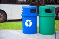 Blue Recycling Bin collects recyclables or recycled material like glass bottles, jars, cartons, plastic bottles and cans. Green Royalty Free Stock Photo