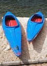 Blue and red canoes (big and small) Royalty Free Stock Photo