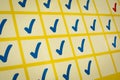 Blue and red checkmarks in yellow grid Royalty Free Stock Photo