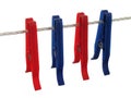 Blue and red clothespins on a clothes line (+ clipping path) Royalty Free Stock Photo