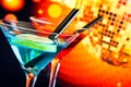 Blue and red cocktail with sparkling disco ball background with space for text Royalty Free Stock Photo