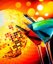 Blue and red cocktail with sparkling disco ball background with space for text selected focus Royalty Free Stock Photo