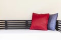 Red cushions on a white fabric long sofa in a modern home living room Royalty Free Stock Photo