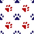 Blue and red footprint of an animal cat icon isolated seamless pattern on white background. Vector Royalty Free Stock Photo