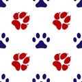 Blue and red footprint of an animal dog and cat icon isolated seamless pattern on white background. Vector Royalty Free Stock Photo