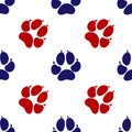 Blue and red footprint of an animal dog icon isolated seamless pattern on white background. Vector Royalty Free Stock Photo