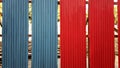 Blue and red galvanized iron fence Royalty Free Stock Photo
