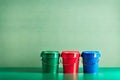 Blue, red green plastic bucket for cleaning isolated on pastel background.Isolated on pastel background. Royalty Free Stock Photo