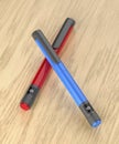 Blue and red insulin pens Royalty Free Stock Photo