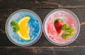 Blue Red Italian Soda Cold Beverage and Lemon Strawberry Fruit Close Up 2 Royalty Free Stock Photo