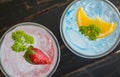 Blue Red Italian Soda Cold Beverage and Lemon Strawberry Fruit Close Up Royalty Free Stock Photo