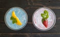 Blue Red Italian Soda Cold Beverage and Lemon Strawberry Fruit Royalty Free Stock Photo