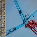 Blue and red metal constructions attached to each other during daytime Royalty Free Stock Photo