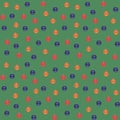 Blue, red, orange Christmas balls on a green background. Seamless vector pattern.