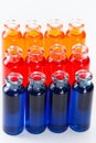 Blue, red and orange liquid in chemical lab test tubes on white background Royalty Free Stock Photo