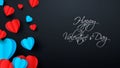 Blue and red paper elements in the shape of a heart flying on a dark background. Vector symbols of love for happy women Royalty Free Stock Photo