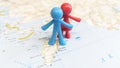 A blue and red rubber toy couple standing on the island of Rhodes on a map of Greece Royalty Free Stock Photo