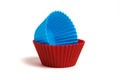 Blue and red silicone molds for baking a cupcake on a white background Royalty Free Stock Photo