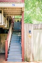 Blue and Red Staircase Outdoors Tucked in a Little Street Royalty Free Stock Photo