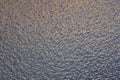 Blue-red surface of ice with shades of lilac, similar to mercury. Small wriggling pattern. Dark abstract winter background or Royalty Free Stock Photo