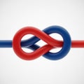 A blue and red trefoil knot interlocks, forming an infinity symbol with smooth, glossy Royalty Free Stock Photo